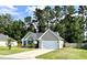 Attractive one-story home featuring a manicured lawn, a driveway, and mature landscaping for enhanced privacy at 3006 Central Ring Ct, Ridgeville, SC 29472