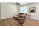Inviting living room with wood floors, ceiling fan, and lots of natural light at 3006 Central Ring Ct, Ridgeville, SC 29472