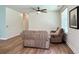 Comfortable living room with ceiling fan and wood floors, perfect for relaxation at 3006 Central Ring Ct, Ridgeville, SC 29472