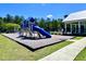 Community playground area with a slide, swing set, and a covered picnic area at 3006 Central Ring Ct, Ridgeville, SC 29472