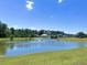 Enjoy the view of this pond with fountain and community in the distance at 3006 Central Ring Ct, Ridgeville, SC 29472