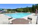 Relax by the sparkling community pool with lounge chairs and nearby playground at 3006 Central Ring Ct, Ridgeville, SC 29472