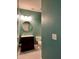 Stylish powder room with vanity, round mirror, and modern fixtures at 3006 Central Ring Ct, Ridgeville, SC 29472
