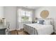 Bedroom featuring a metal frame bed, natural light, and minimalist decor at 313 Willow Run Dr, Summerville, SC 29486