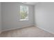 Bright bedroom featuring a window with a view and neutral carpeting for a comfortable space at 314 O'Malley Dr, Summerville, SC 29483