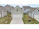View of garages in the neighborhood, showcasing the architecture and landscaping at 314 O'Malley Dr, Summerville, SC 29483