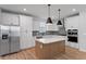 Bright kitchen with stainless steel appliances, white cabinets, and a center island at 314 O'Malley Dr, Summerville, SC 29483