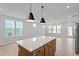 Open floor plan featuring a kitchen island, with stainless steel appliances and plentiful natural light at 314 O'Malley Dr, Summerville, SC 29483