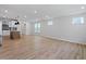 Spacious open floor plan with kitchen island, stainless appliances, and adjacent living area with large windows at 314 O'Malley Dr, Summerville, SC 29483