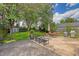 Charming backyard featuring a patio set, grill, storage shed, and ample space for relaxation and entertainment at 4587 Durant Ave, North Charleston, SC 29405