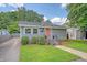 This charming home features a well-manicured lawn, neat landscaping, and a welcoming walkway at 4587 Durant Ave, North Charleston, SC 29405