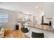 Modern kitchen with white cabinets, granite countertops, stainless steel appliances, and an island with seating at 4587 Durant Ave, North Charleston, SC 29405