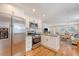 Open concept kitchen with stainless steel appliances, granite counters, and a view into the adjacent living area at 4587 Durant Ave, North Charleston, SC 29405