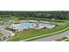 Aerial view of the community showcasing the pool, clubhouse, playground, and surrounding green spaces and residential areas at 491 Cedarview Rd, Summerville, SC 29486