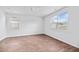 Bright bedroom features wood-look floors, two large windows for ample natural light, and a ceiling fan at 491 Cedarview Rd, Summerville, SC 29486