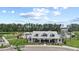 Beautiful community pool with modern clubhouse, pool slide, and amenities, set against a backdrop of mature trees at 491 Cedarview Rd, Summerville, SC 29486