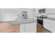 Bright kitchen with stainless steel appliances, granite countertops, and an island with a sink at 491 Cedarview Rd, Summerville, SC 29486