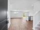 Bright, open living space with wood floors, ceiling fan, and sliding doors to the backyard. Flooded with natural light at 491 Cedarview Rd, Summerville, SC 29486