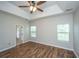 This primary bedroom features hardwood floors, natural light, and an en-suite bathroom at 5023 Manor Rd, Hollywood, SC 29449