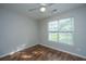 This bedroom features hardwood floors and a window that lets in plenty of natural light at 5023 Manor Rd, Hollywood, SC 29449