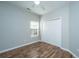 This bedroom features hardwood floors and a closet with doors at 5023 Manor Rd, Hollywood, SC 29449
