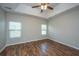 This bedroom features hardwood floors and natural light at 5023 Manor Rd, Hollywood, SC 29449