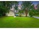 Charming single-Gathering home with a well-manicured lawn and mature trees at 5023 Manor Rd, Hollywood, SC 29449