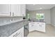 Kitchen featuring granite countertops, stainless steel dishwasher, and white cabinets at 5023 Manor Rd, Hollywood, SC 29449