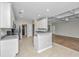 Open kitchen featuring granite counters, white cabinets, and view into the living space at 5023 Manor Rd, Hollywood, SC 29449