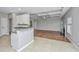 Open-concept living room with coffered ceiling, fireplace, and granite countertop at 5023 Manor Rd, Hollywood, SC 29449