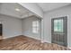 Inviting living room featuring laminate floors, and a stylish front door at 5023 Manor Rd, Hollywood, SC 29449