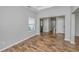 Bright living room with hardwood floors, large window and entry to foyer at 5023 Manor Rd, Hollywood, SC 29449