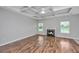 Spacious living room features a fireplace, and a modern ceiling fan at 5023 Manor Rd, Hollywood, SC 29449