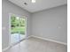 Sun-filled room with sliding door to backyard at 5023 Manor Rd, Hollywood, SC 29449
