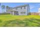 Well-maintained backyard with green grass, wooden fence, and screened porch at 504 Sarno Way, Summerville, SC 29486