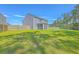Spacious backyard with lawn and an enclosed porch, perfect for entertaining at 504 Sarno Way, Summerville, SC 29486