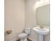 Powder room features a pedestal sink, wood-look flooring and modern fixtures at 504 Sarno Way, Summerville, SC 29486