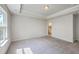 Bedroom features a large window with natural light, carpet, and a tray ceiling at 504 Sarno Way, Summerville, SC 29486