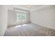 Simple bedroom featuring neutral walls and carpet, a window and closet at 504 Sarno Way, Summerville, SC 29486