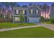 Charming two-story home with a well-manicured lawn and attached two car garage at 504 Sarno Way, Summerville, SC 29486