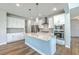 Beautiful kitchen with stainless steel appliances, large island and modern pendant lights at 504 Sarno Way, Summerville, SC 29486