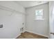 Bright laundry room with wood-look flooring, window, and hookups at 504 Sarno Way, Summerville, SC 29486