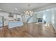 Open concept living room and kitchen featuring a breakfast bar and fireplace at 504 Sarno Way, Summerville, SC 29486