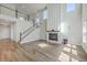 Bright and airy living room boasts a fireplace, wood floors and plenty of natural light at 504 Sarno Way, Summerville, SC 29486
