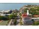 Aerial view showcases this downtown home with a red roof and waterfront views in the distance at 55 E Bay St, Charleston, SC 29401