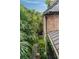 Cozy backyard with beautiful landscaping, brick accents and stone walkways at 55 E Bay St, Charleston, SC 29401