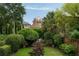 Picturesque backyard garden with lush greenery and glimpses of the charming architecture at 55 E Bay St, Charleston, SC 29401