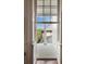 The balcony with white columns offers a view of the backyard at 55 E Bay St, Charleston, SC 29401