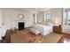 Bright, spacious bedroom featuring a decorative fireplace, light walls and hardwood flooring at 55 E Bay St, Charleston, SC 29401
