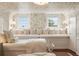 Charming bedroom with patterned wallpaper, built-in seating, and large windows at 55 E Bay St, Charleston, SC 29401